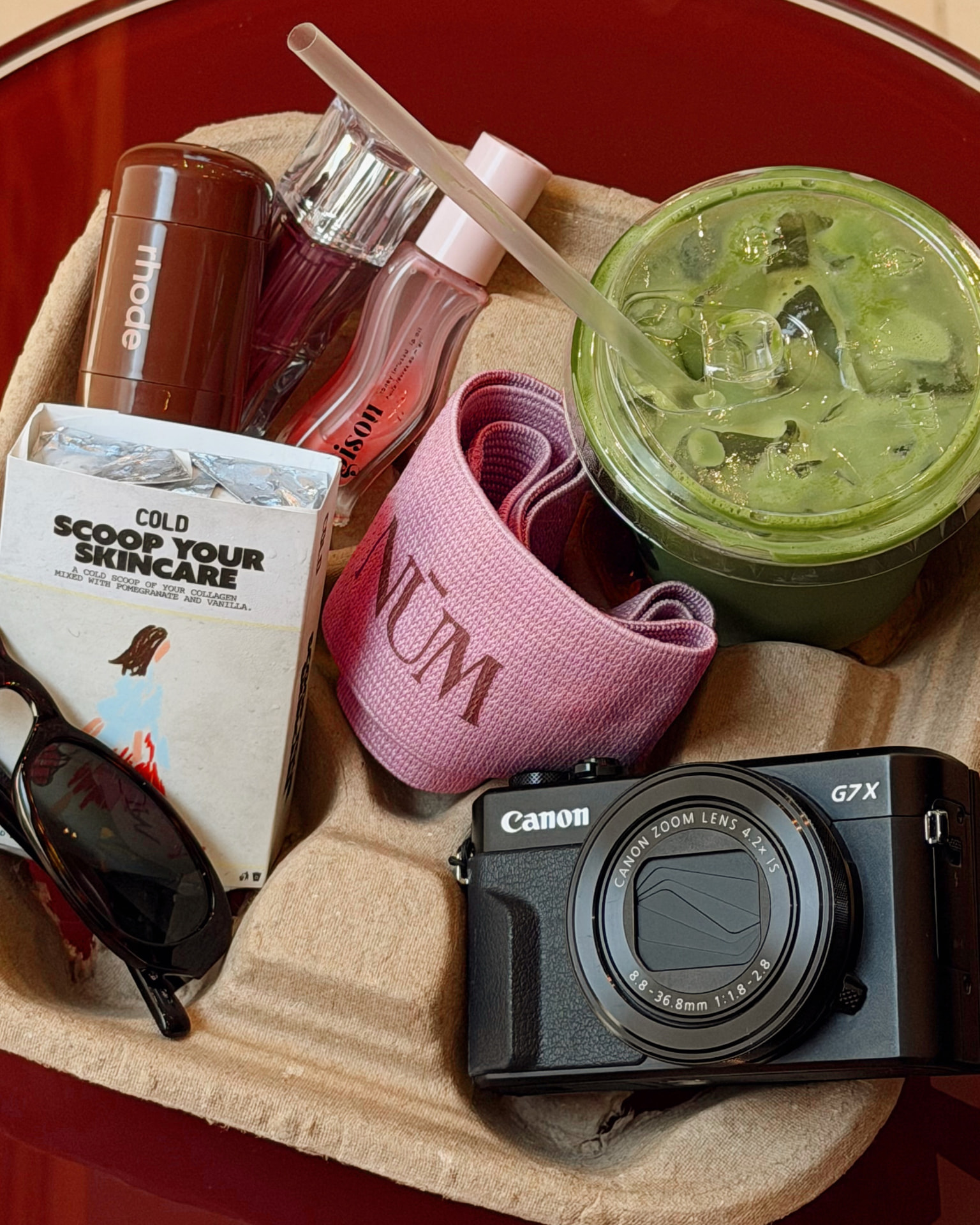 NŪM post-workout essentials with a green drink and Scoop Your Skincare